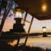 Multi-purpose aluminum camping lantern hook hanging an LED lantern inside tent at campsite